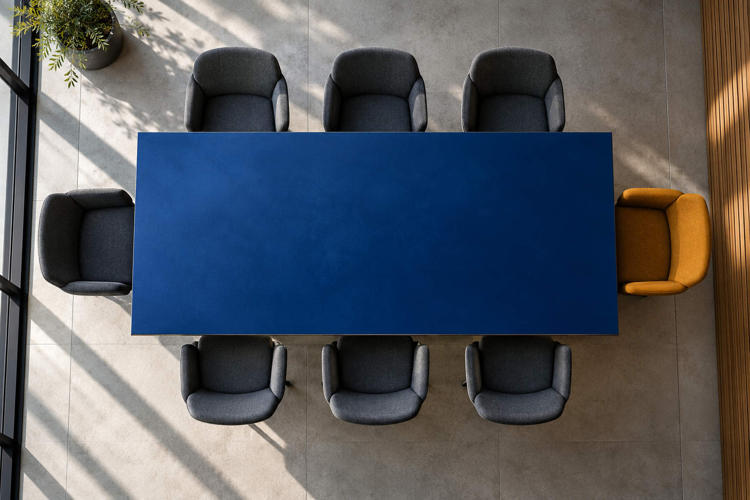 Vue conceptuelle de chaises d’entretien autour d’une table bleue, évoquant les postes à pourvoir.